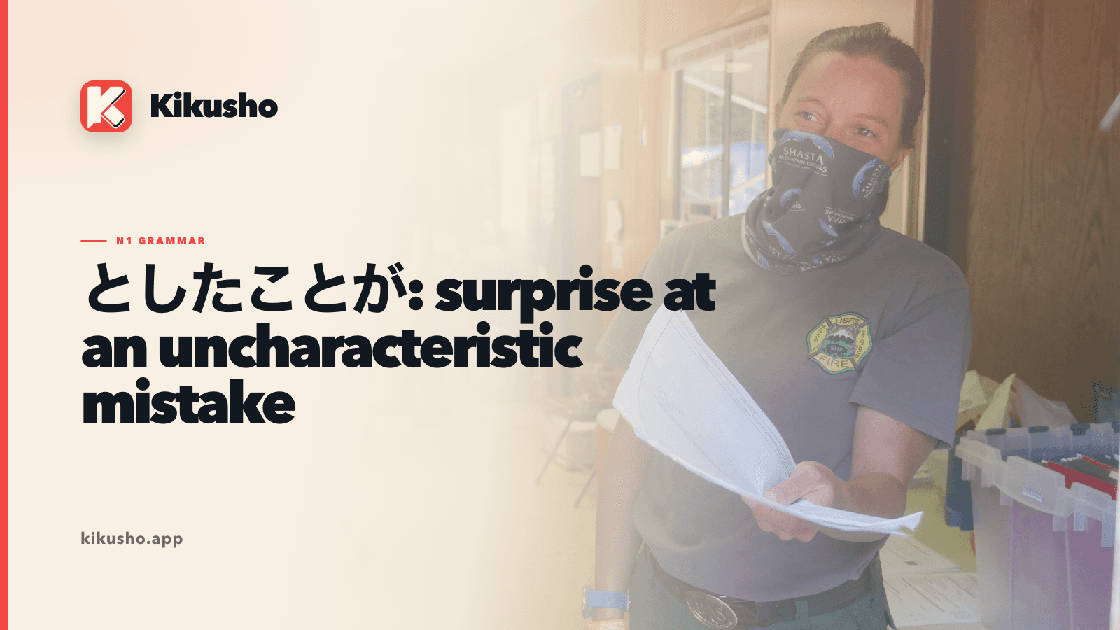 A woman firefighter holding paperwork on a cream Kikusho grammar card about an uncharacteristic mistake.
